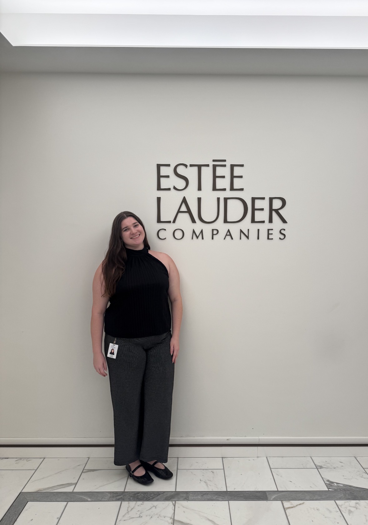 Anna Pearl Gordon at the Estée Lauder Companies office signage
